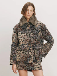 Front view of the Veronica Beard Blake Brocade Coat in Dark Eggplant Multi with faux fur collar and matching skirt.