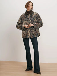 Full length view of the Veronica Beard Blake Brocade Coat in Dark Eggplant Multi with flare jeans.