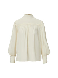 Flat lay of the Veronica Beard Brooks Mock-Neck Blouse in Dove White with blouson sleeves and wide yoke.