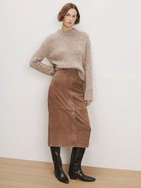 Front view of the Veronica Beard Callisian Suede Midi Skirt in Bark styled with a knit sweater and tall boots.