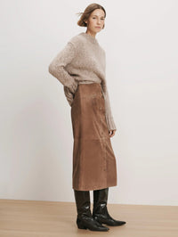 Side view of the Veronica Beard Callisian Suede Midi Skirt in Bark with its A-line midi shape.