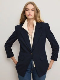 Close view of the Veronica Beard Ivory merino wool-cashmere dickey zipped under a navy blazer