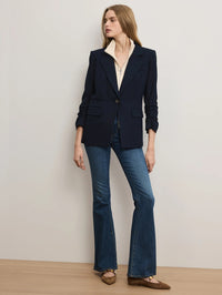 Full-length view of the Veronica Beard Ivory merino wool-cashmere dickey styled under a navy blazer with flare jeans