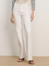 Front view of the Crosbie Mid Rise Wide Leg Jean in white by Veronica Beard, styled with striped shirt