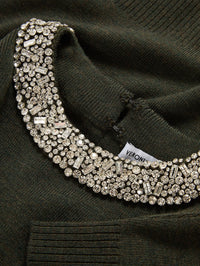 Close-up of the crystal-embellished collar and back hook closure on the Veronica Beard Daro Sweater in Green Shadow.