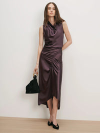 Veronica Beard Felecia Midi Skirt in Dark Eggplant styled with a matching satin cowl neck top.