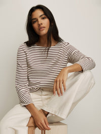 Front view of the Hovey Top in Dove/Raisin striped long-sleeve by Veronica Beard, styled with white pants