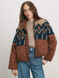 Front view of the Veronica Beard Knoll Sherpa Jacket in Deep Ochre worn over a knit sweater and jeans.
