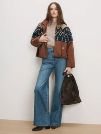 Full-length view of the Veronica Beard Knoll Sherpa Jacket in Deep Ochre styled with wide-leg denim.
