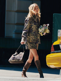 Street style shot of the Veronica Beard Ohemia Brocade Mini Skirt in Dark Eggplant Multi with matching coat