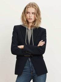Model wearing the Veronica Beard Oversized Hoodie Dickey in Grey Melange under a navy blazer with denim