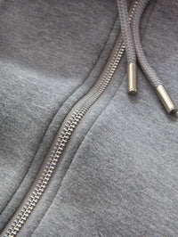 Close up of the silver zipper and metal aglets on the Veronica Beard Oversized Hoodie Dickey in Grey Melange