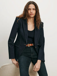 Front view of the Veronica Beard Miller Denim Single-Breasted Dickey Jacket in Midnight Wash with a belted dark jean