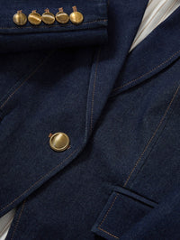 Close-up of the gold buttons and contrast stitching on the Veronica Beard Miller Denim Dickey Jacket in Midnight Wash