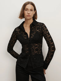 Front view of the Veronica Beard Wittaker Lace Shirt in Black, a sheer floral lace button-down worn with black pants.