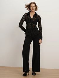 Full-length front view of the Veronica Beard Wittaker Lace Shirt in Black with wide-leg trousers and heels.