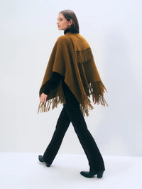 Back view of the White + Warren Cashmere Blend Fringe Poncho in Antique Gold showing fringe at the hem