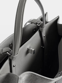 Close-up inside the Zadig & Voltaire Jack Suede Bag in Road grey showing the twist-lock hardware and cotton lining.