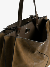 Close-up of the open Jack Suede Bag in wood by ZADIG & VOLTAIRE, revealing the interior with black leather handles
